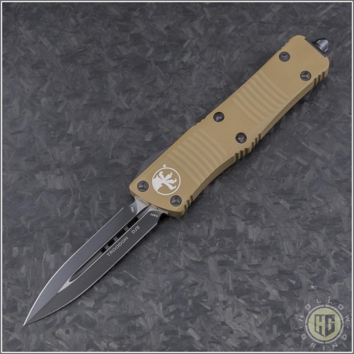 (#138-1TA) Microtech Tan Troodon D/E Black Plain - Front